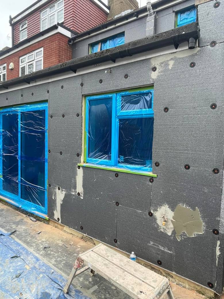 Insulation boards fixed to the extension wall