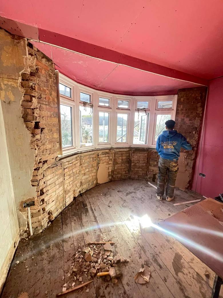 Bay window stripped back to brick